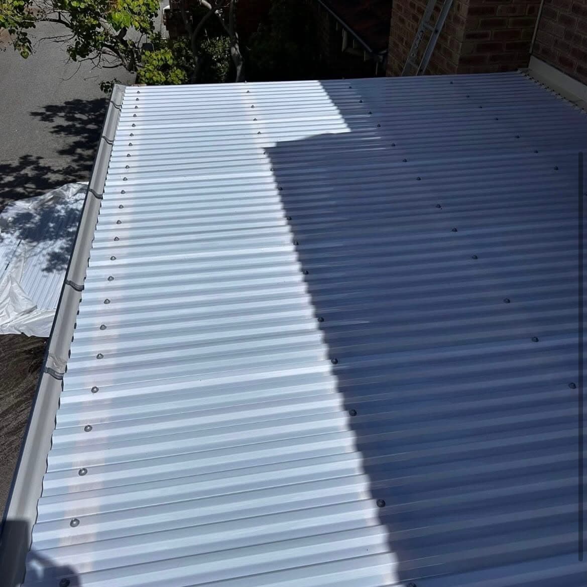 Newly laid corrugated metal roof sheeting